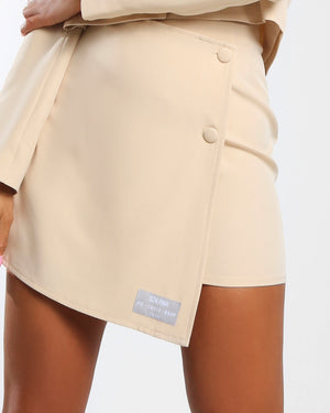 Amber x Public Desire button detail asymmetric mini skirt co-ord in butter